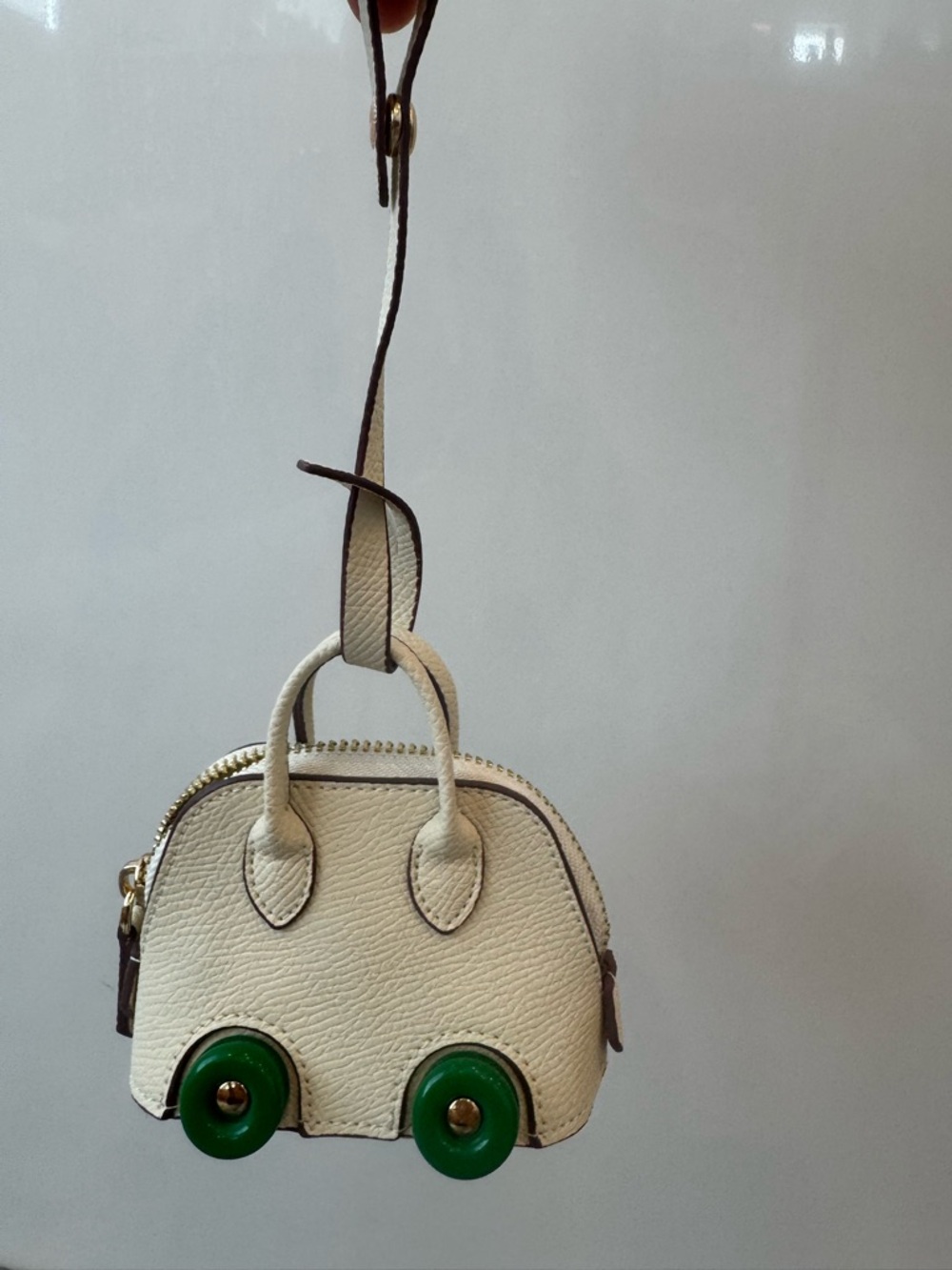 Bag charm purse on wheels bolide style off white and green AirPod case New